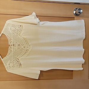 Cream colored blouse with lacey detailing